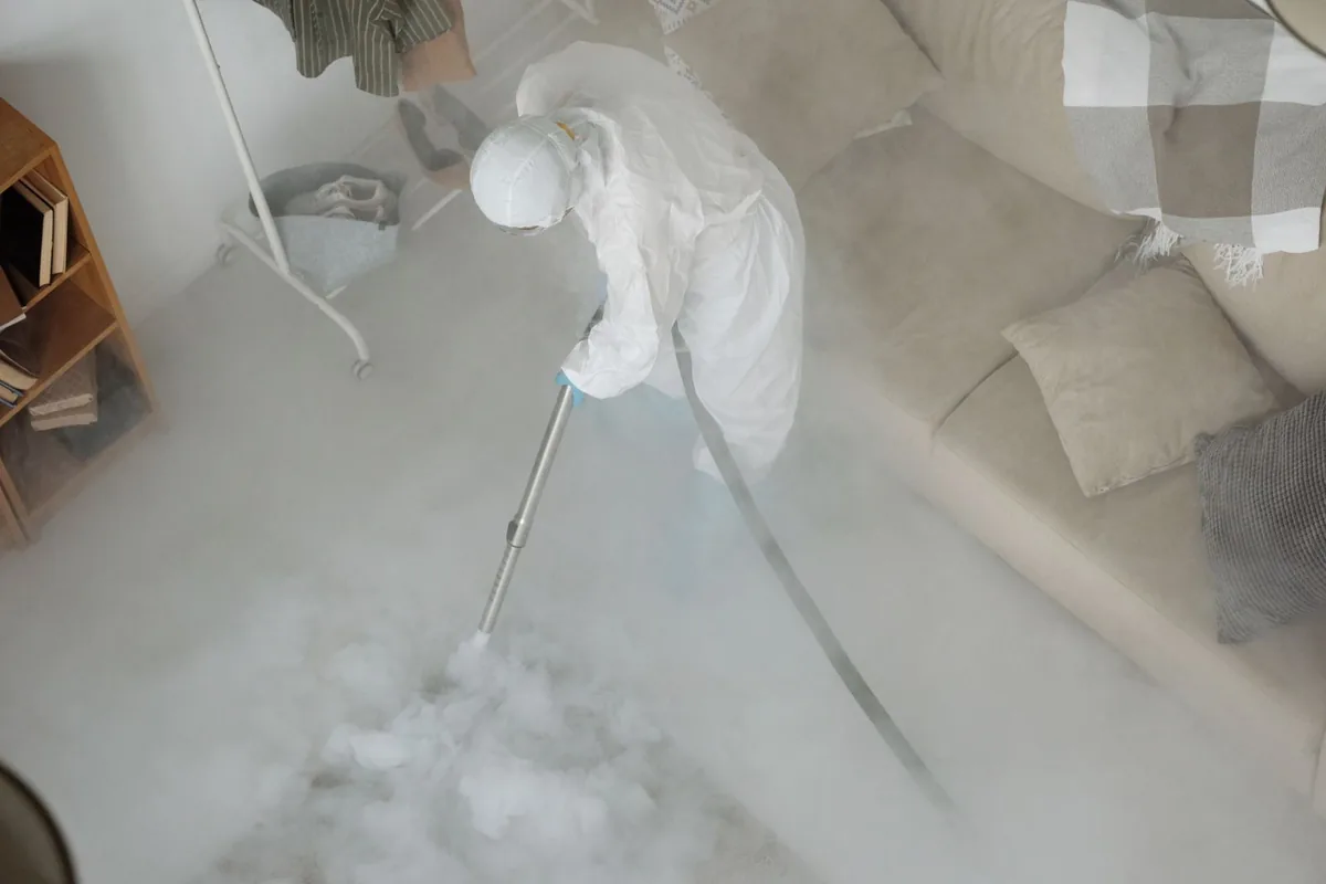 Biohazard cleanup technician in protective equipment, Huntsville, TN